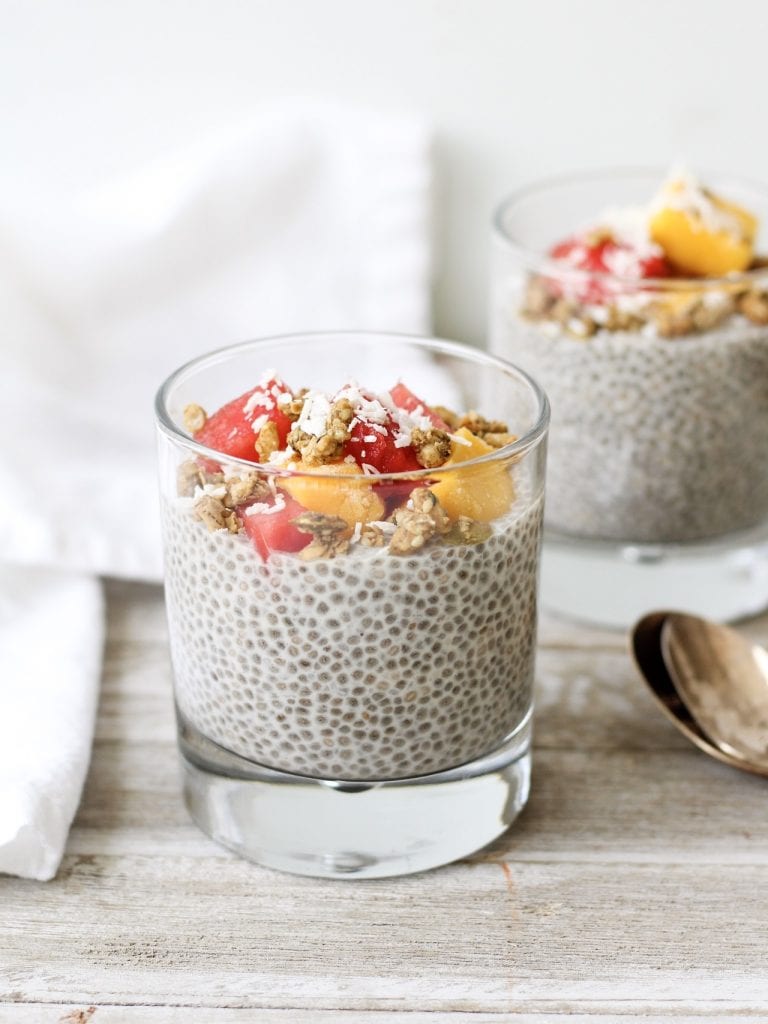 chia pudding in a jar topped with fruit and granola