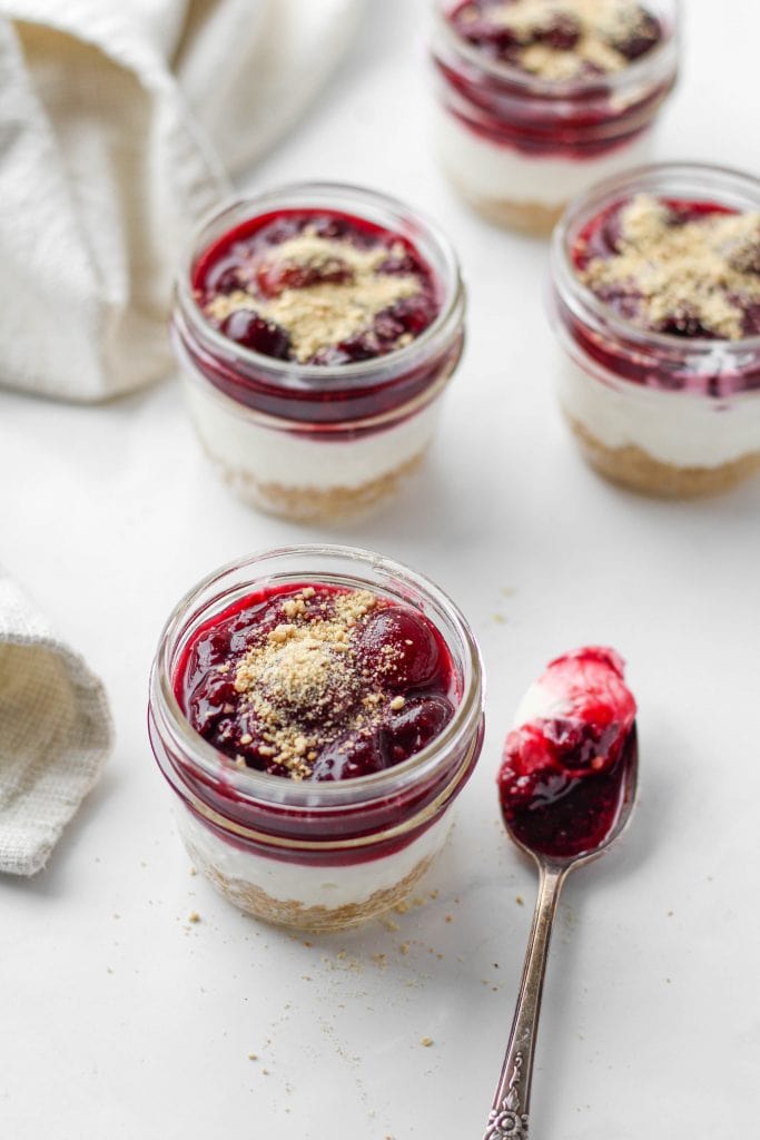 This no-bake cheesecake in a jar is simple + quick to make and it's served in mini mason jars...cute, right? Complete with graham cracker "crust", cheesecake filling, and cherry cheesecake topping!