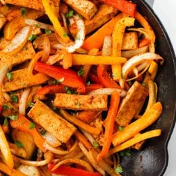 Add these Easy Tofu Fajitas to your list of quick and healthy meals to try! This plant-based recipe takes 30 minutes to make and is packed with protein and nutritious vegetables.