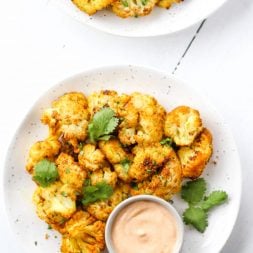 This curry roasted cauliflower is an easy, healthy side dish that makes eating your vegetables delicious! Vegan and gluten-free.