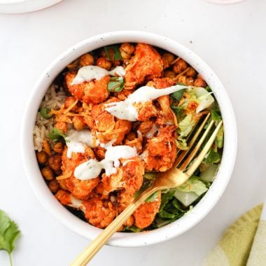 These Buffalo Cauliflower Bowls are loaded with buffalo cauliflower, smoky roasted chickpeas, crisp lettuce, and of course: ranch! A simple, nourishing meal for any day of the week!