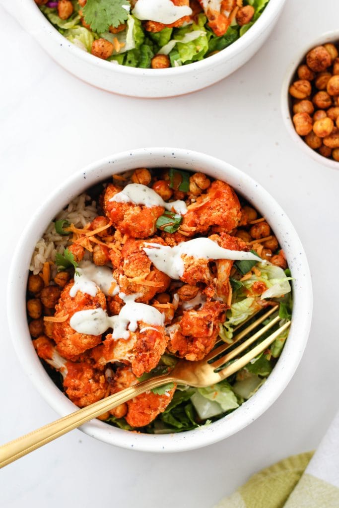 These Buffalo Cauliflower Bowls are loaded with buffalo cauliflower, smoky roasted chickpeas, crisp lettuce, and of course: ranch! A simple, nourishing meal for any day of the week!