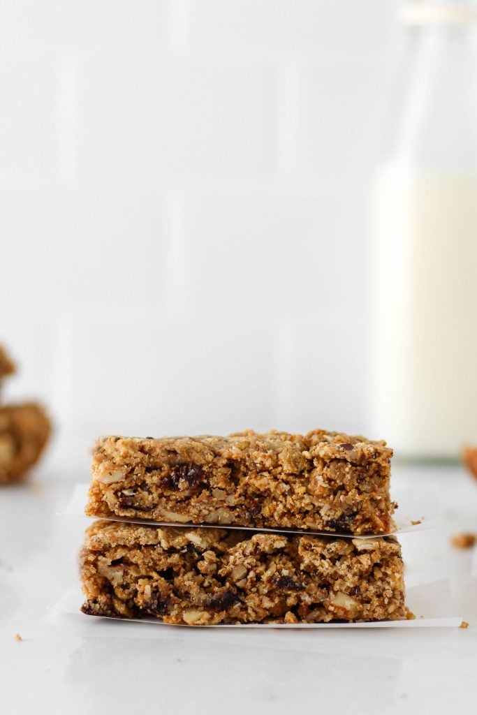These homemade vegan granola bars are the perfect healthy snack to keep on hand. Packed with oats, peanut butter, nuts, seeds, dried fruit, and chocolate - what's not to love?