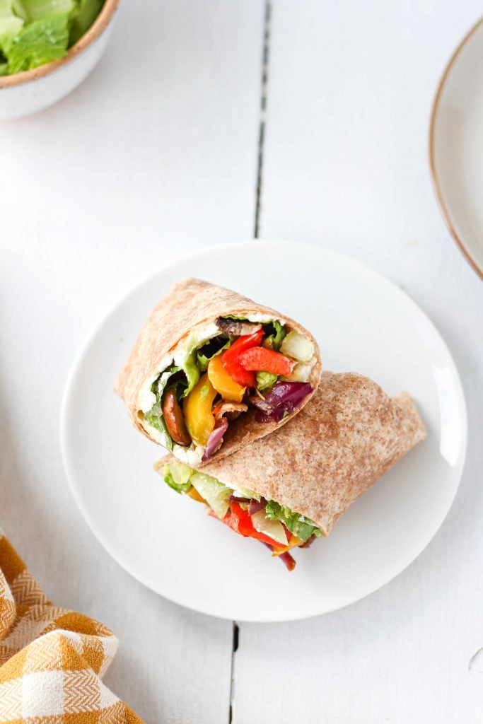 A simple and healthy yet super flavourful Grilled Veggie Wrap filled with balsamic marinated and grilled vegetables, goat cheese and hummus. Makes a delicious healthy lunch or dinner recipe!