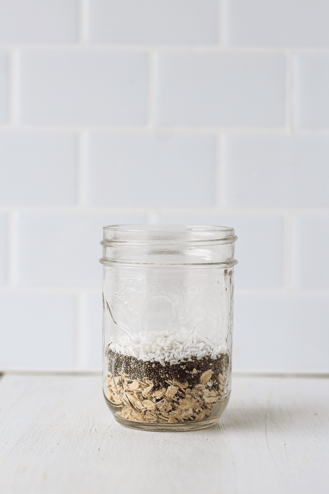 oats, chia seeds and coconut flakes in a jar