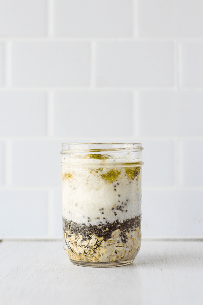oats, chia seeds, coconut flakes, yogurt, honey, coconut milk, and lime zest in a jar
