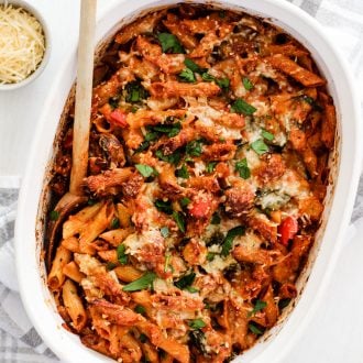 sausage and vegetable pasta bake in a casserole dish