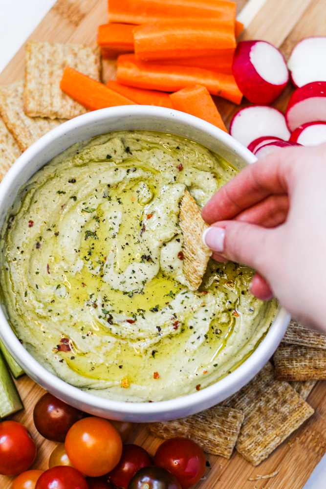 white bean dip with crackers and vegetables