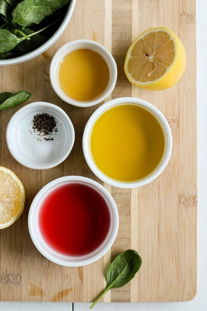 ingredients for lemon olive oil salad dressing in bowls