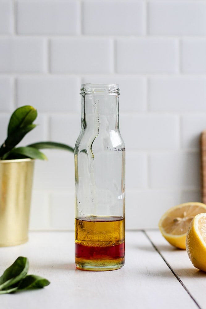 olive oil, red wine vinegar, lemon juice, and honey in a jar