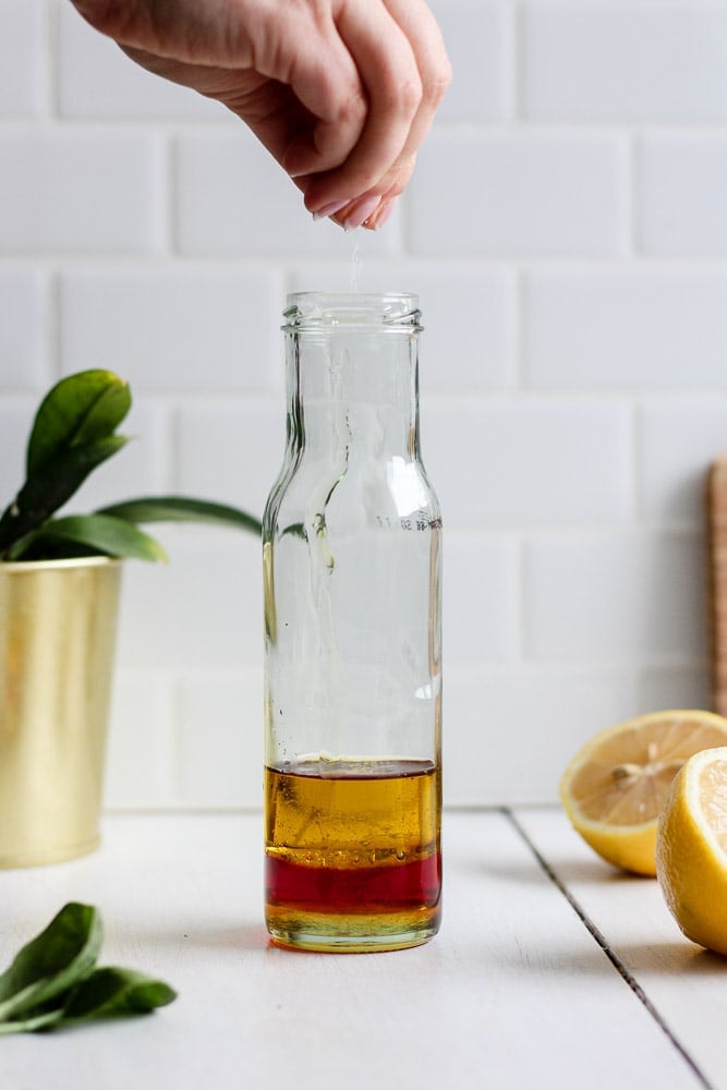 olive oil, red wine vinegar, lemon juice, honey and salt in a jar