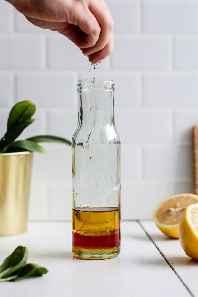 olive oil, red wine vinegar, lemon juice, honey, salt and pepper in a jar