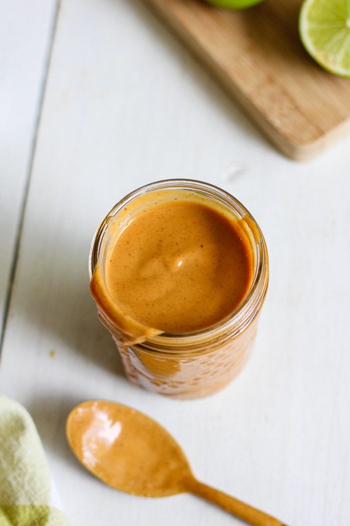 overhead view of peanut sauce in a mason jar