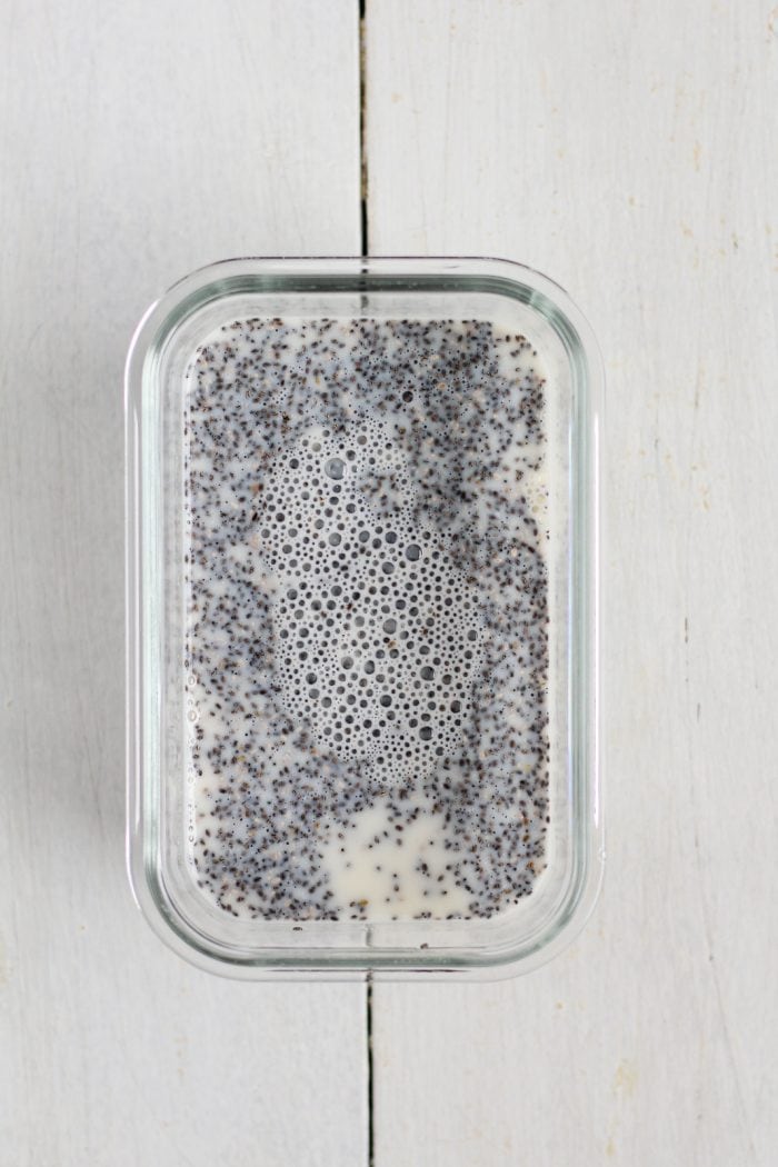 chia seeds, milk, maple syrup, and vanilla extract in a meal prep container