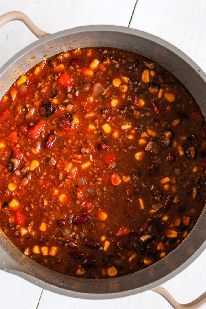 chili mixture in a pot before simmering
