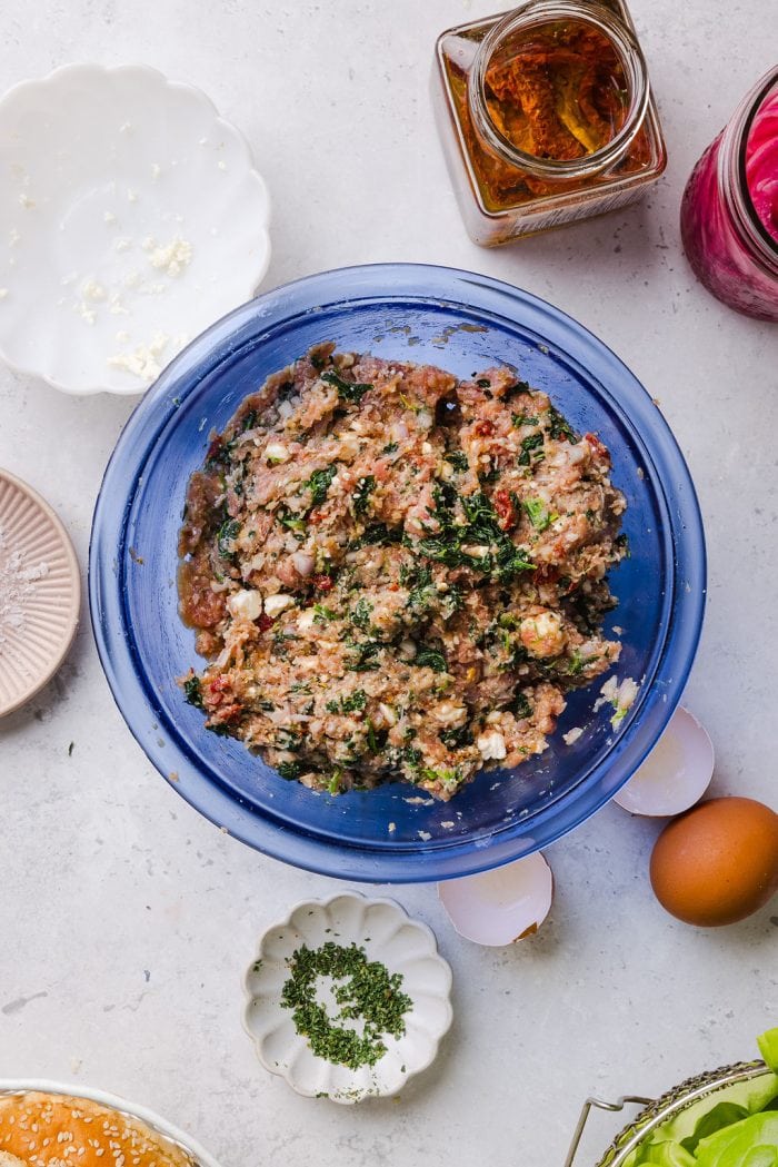 spinach feta turkey burger mixture in a large mixing bowl
